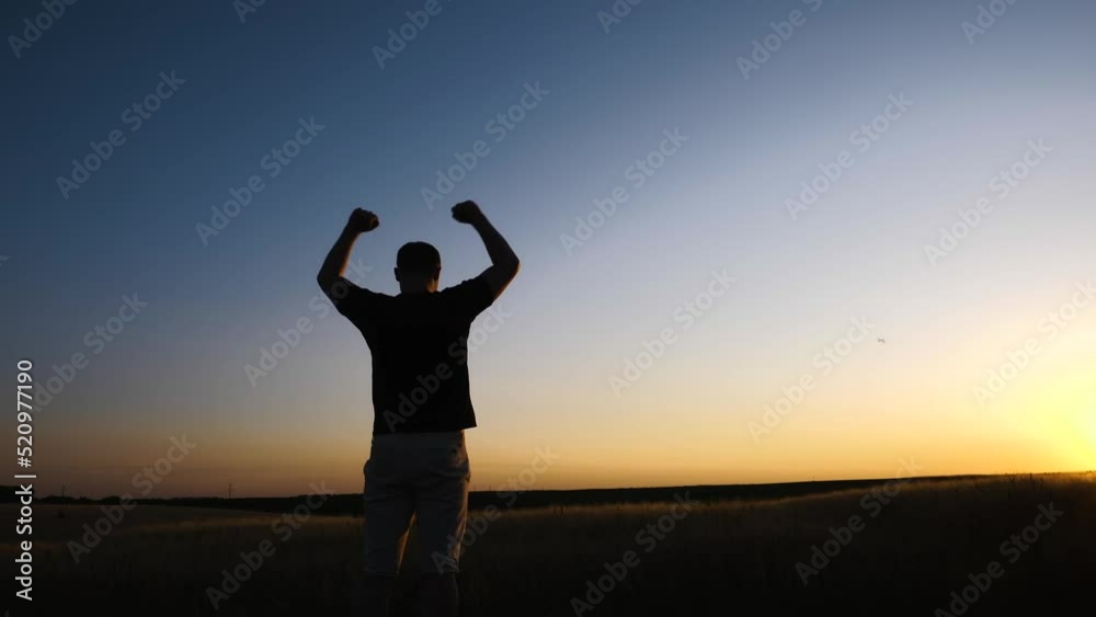 Confident man raising hands up in the air. People success, victory, and power. Confident man raising hands up in the air. People success, victory, and power.