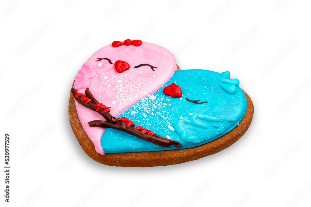 Gingerbread in the shape of a heart, with a picture of birds . Isolated on white background Gingerbread in the shape of a heart, with a picture of birds . Isolated on white background