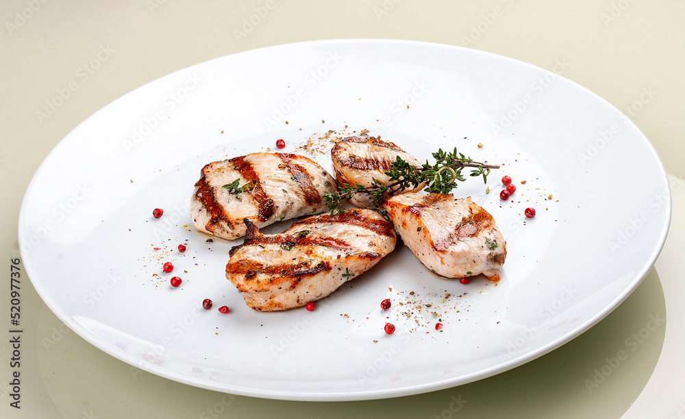 Grilled chicken breast on white background Grilled chicken breast on white background