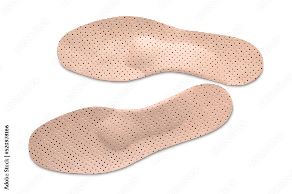 Beige orthopedic insoles isolated on white, top view Beige orthopedic insoles isolated on white, top view