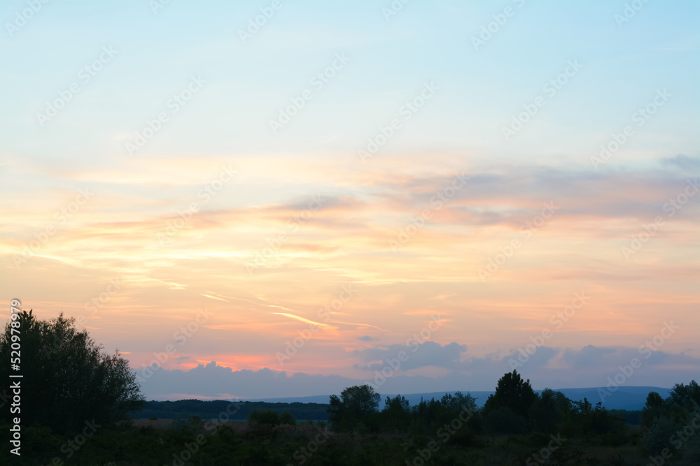 Picturesque view of beautiful countryside at sunset