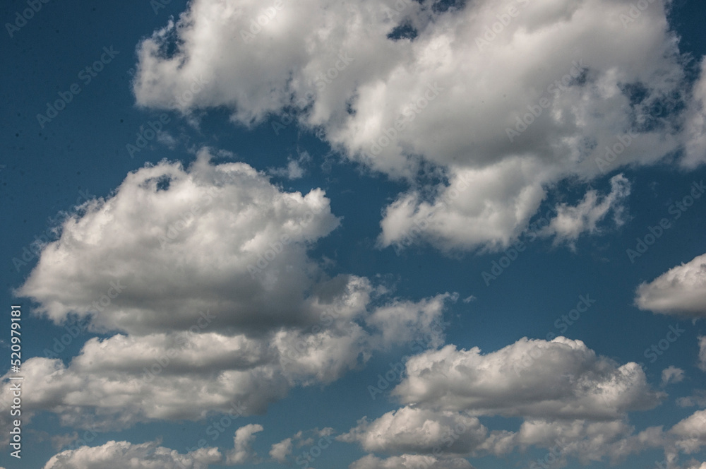 white fluffy clouds in the blue sky white fluffy clouds in the blue sky