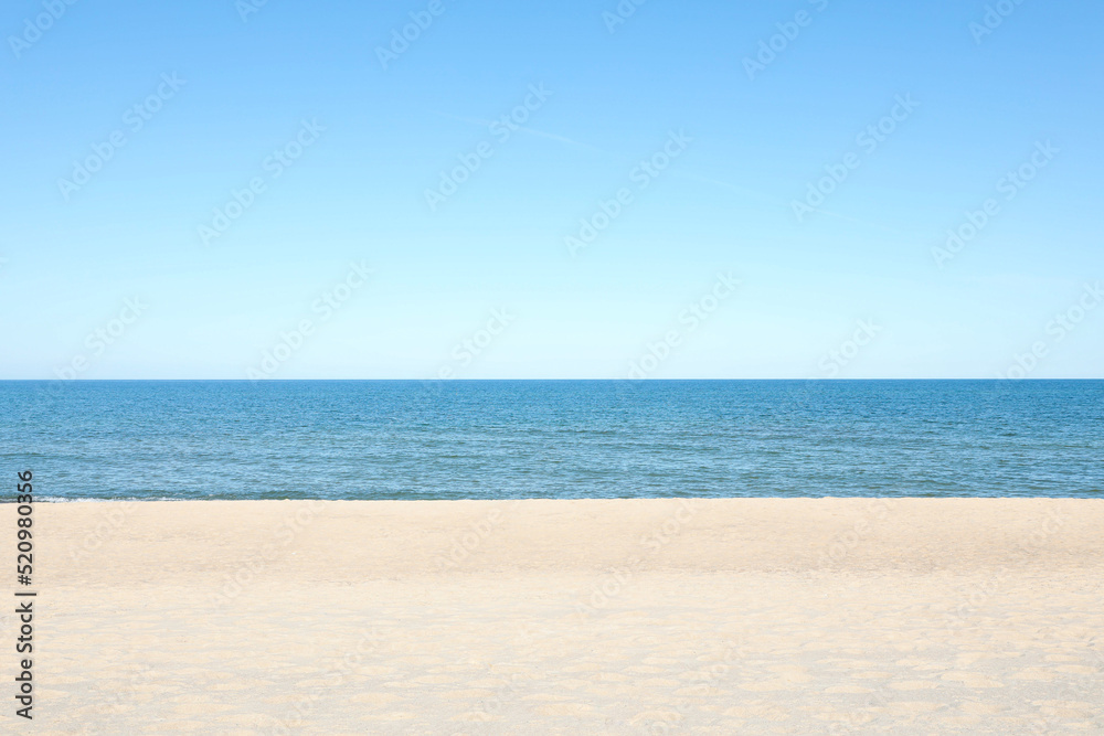 Picturesque view of sandy beach near sea