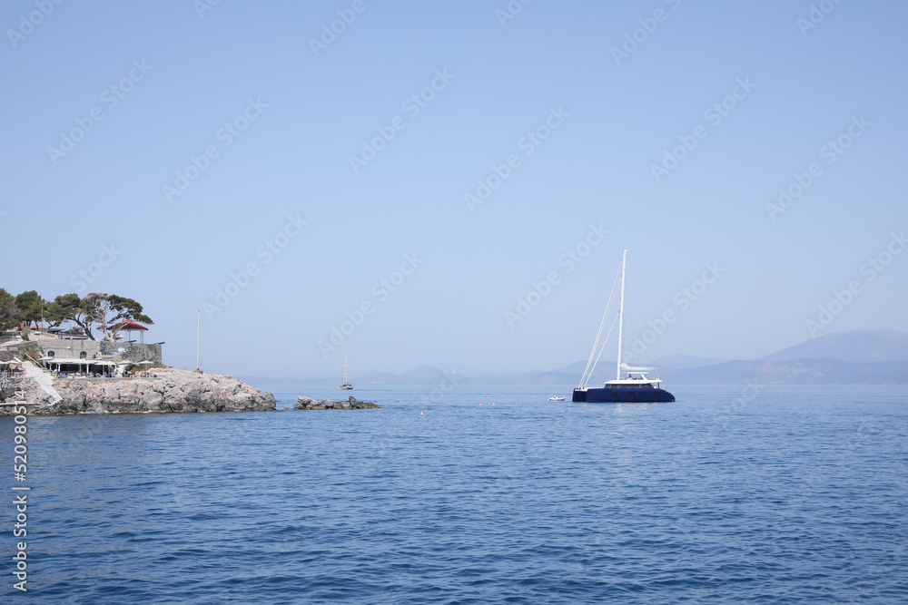 Beautiful view of sea with boat and coastal city