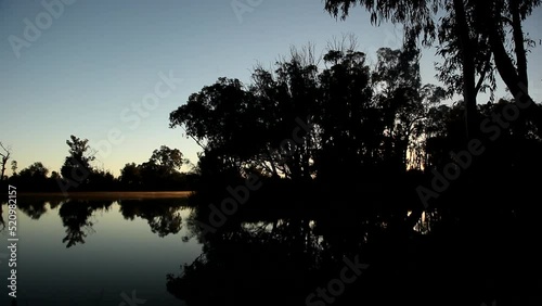 Sun rising over the Murray River - Loxton, South Australia photo