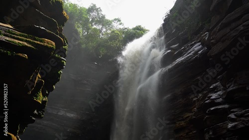 Gorgeous 4K handheld shot of the beautiful Mosquito waterfall from below looking up at the water falling in the Chapada Diamantina National Park in the Northeastern State of Brazil Bahia. photo