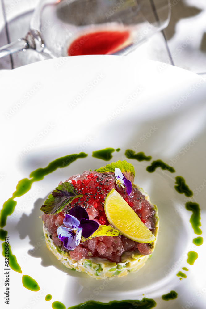 Salad with tuna, lemon, sorrel, violet, sesame, tobiko caviar, sauce, avocado, cucumber and mayonnaise Salad with tuna, lemon, sorrel, violet, sesame, tobiko caviar, sauce, avocado, cucumber and mayonnaise