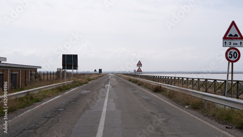 road near Salt pan of Margherita di Savoia. Apulia, Italy. salt processing.