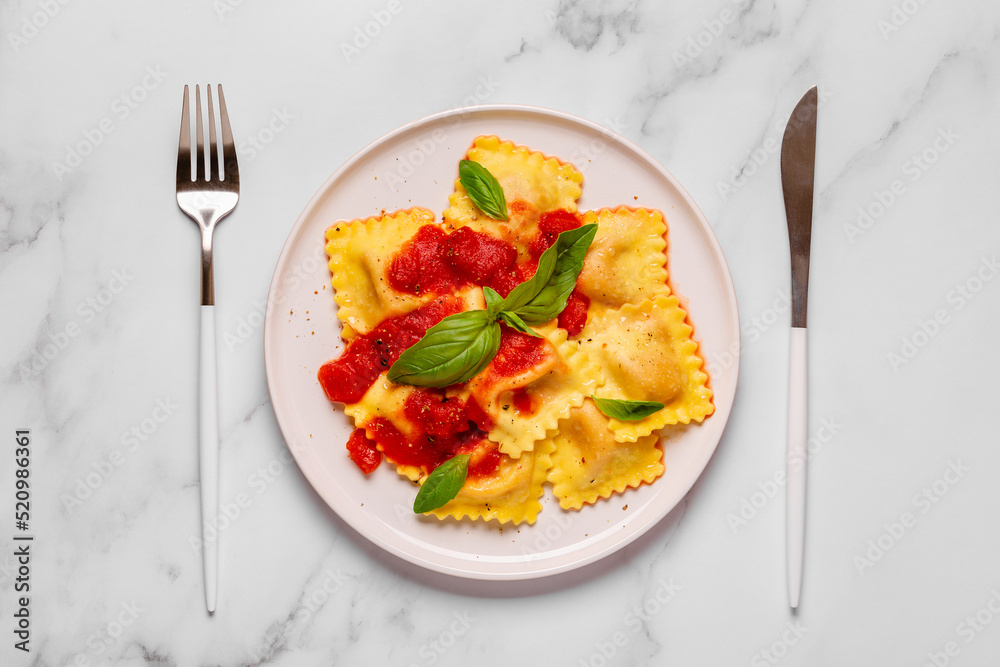 Delicious appetizing ravioli with tomato sauce and basil Delicious appetizing ravioli with tomato sauce and basil
