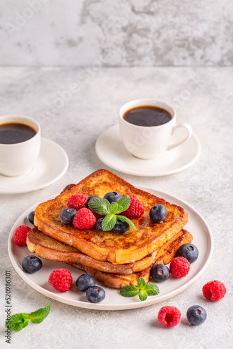 French toast with blueberries, raspberries, maple syrup