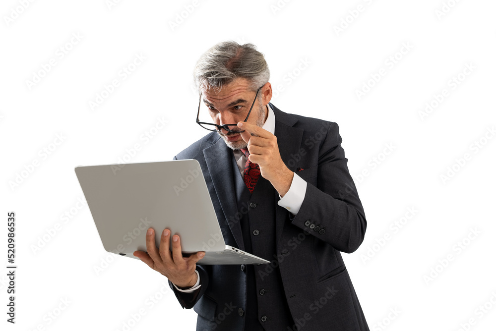 Portrait of Businessman in elegant blue suit wearing eye glasses looking at his laptop screen keeping hand on glasses. isolated on white background with copy space. Portrait of Businessman in elegant blue suit wearing eye glasses looking at his laptop screen keeping hand on glasses. isolated on white background with copy space.
