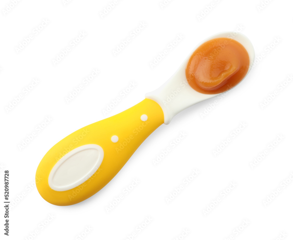 Healthy baby food in spoon isolated on white, top view Healthy baby food in spoon isolated on white, top view