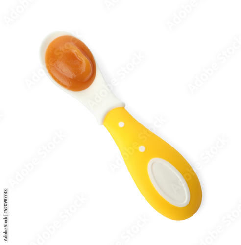 Healthy baby food in spoon isolated on white, top view
