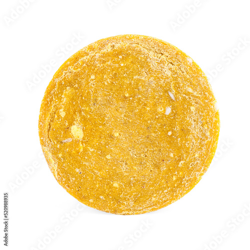 Yellow solid shampoo isolated on white. Hair care