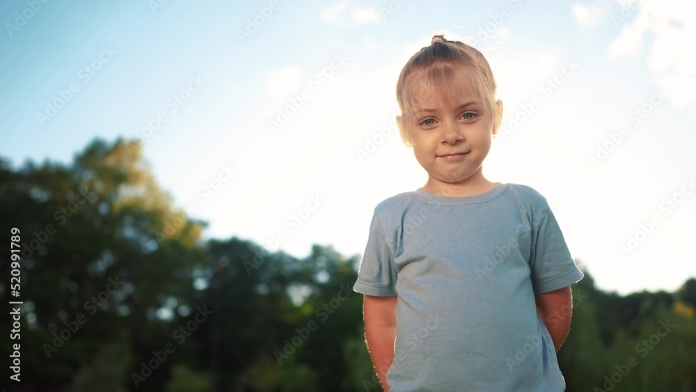 little girl portrait in the park. close-up a girl child in nature. happy family kid concept. happy girl smiling. cheerful little girl portrait close-up. child outdoors nature in the park sunlight little girl portrait in the park. close-up a girl child in nature. happy family kid concept. happy girl smiling. cheerful little girl portrait close-up. child outdoors nature in the park sunlight