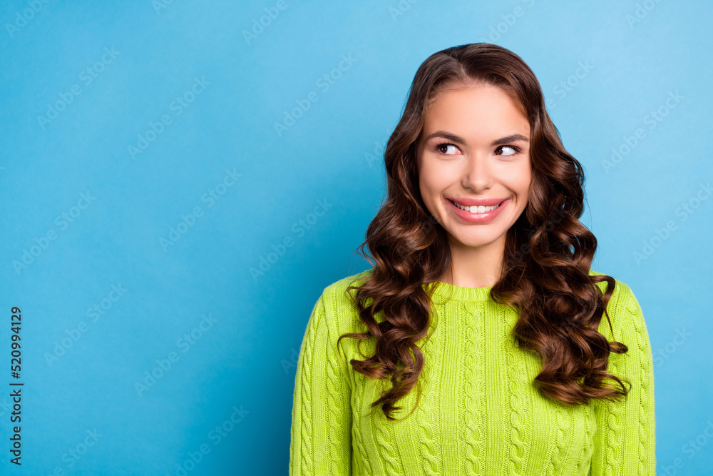 Photo of lovely wondered girl curly hairdo look empty space dressed trendy fall green knitted pullover isolated on blue color background Photo of lovely wondered girl curly hairdo look empty space dressed trendy fall green knitted pullover isolated on blue color background
