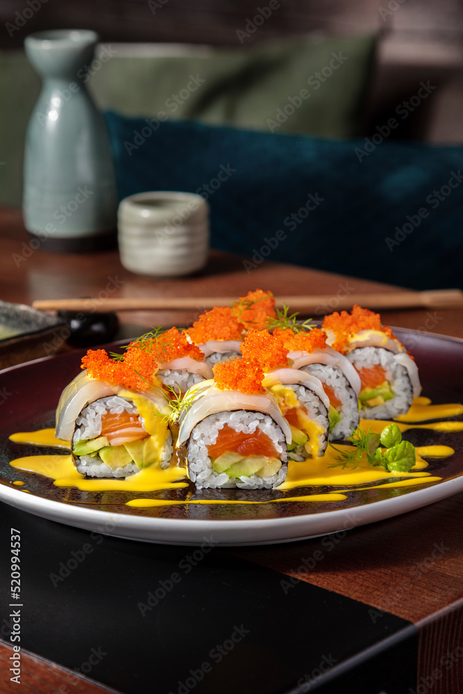 Rolls with salmon, tobiko caviar, dill, squid, avocado Rolls with salmon, tobiko caviar, dill, squid, avocado