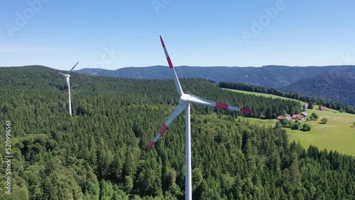 Aerial video of wind power plant on the hilltop between fir trees. St. Peter, Black forest, Germany.
Concept  for regenerative energy and energy crisis.