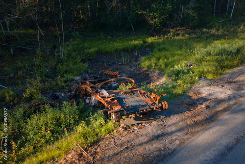 The war in Ukraine, Destroyed and burned russian battle tank of the Russian invaders in Ukraine 2022, Kiev region photo