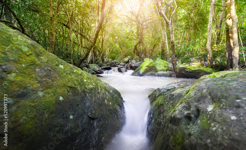 Thao To Waterfall. river background with small waterfalls in tropical forest.It flows from the rainforest mountain in the mountains of Nong Bua Lam Phu in Thailand is a beautiful landscape.