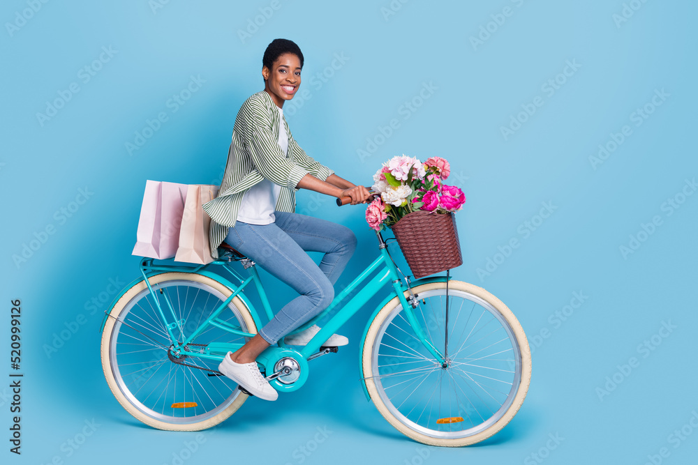 Photo of funky sweet short hair person dressed green shirt vehicle driver delivering peonies isolated blue color background