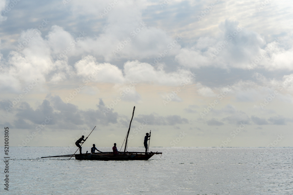 Naklejka premium tradiional african dhow canoes as used for fishing