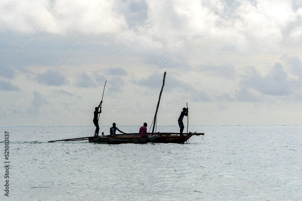 Naklejka premium tradiional african dhow canoes as used for fishing
