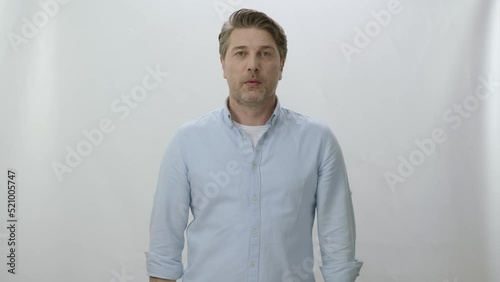 Happy caucasian man isolated over white studio background, smiling with white healthy teeth, positive young man in casual clothes looking at camera. Portrait of happy 40 years old man.