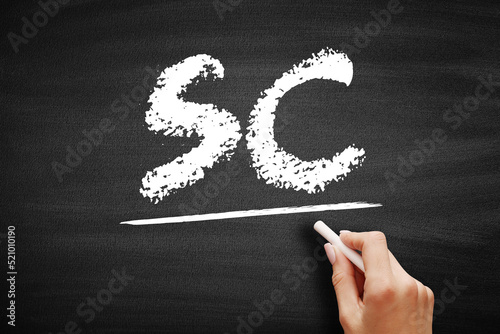 SC Sunk Cost - cost that has already been incurred and that cannot be recovered, acronym text concept on blackboard photo