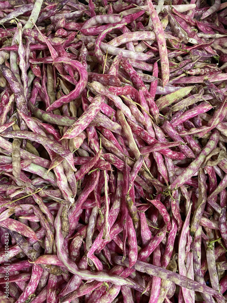 Fresh red beans (roman beans) as background on market stall