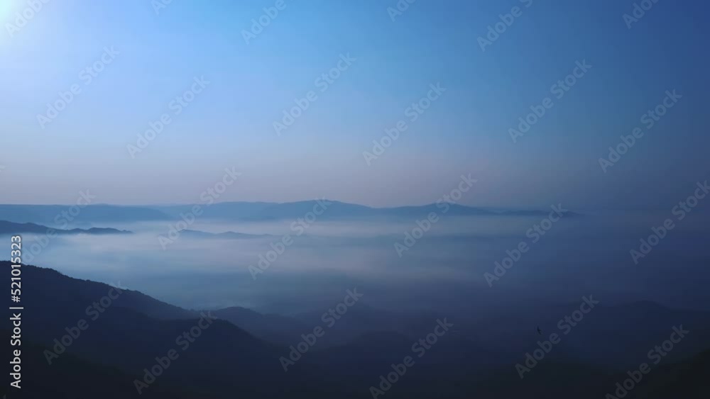 aerial view of misty foggy morning autumn mountains with clouds. Rainy weather in mountains. Misty fog, Aerial, spruce forest trees on mountain hills at misty day. Morning fog beautiful autumn forest. aerial view of misty foggy morning autumn mountains with clouds. Rainy weather in mountains. Misty fog, Aerial, spruce forest trees on mountain hills at misty day. Morning fog beautiful autumn forest.