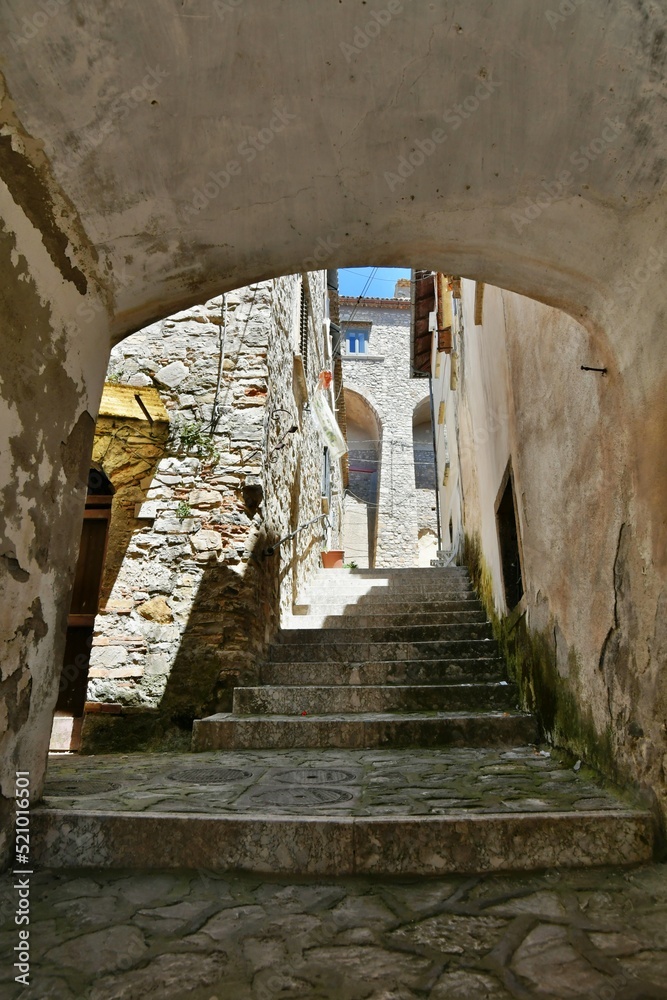 Obraz premium A small street between the old houses of Zungoli, one of the most beautiful villages in Italy.