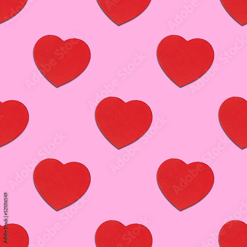 A seamless pattern of red hearts on a pink background. Valentine s Day  Love