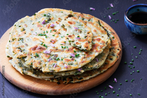 Obraz na płótnie Homemade appetizing scallion pancakes served with soy sauce. w salonie