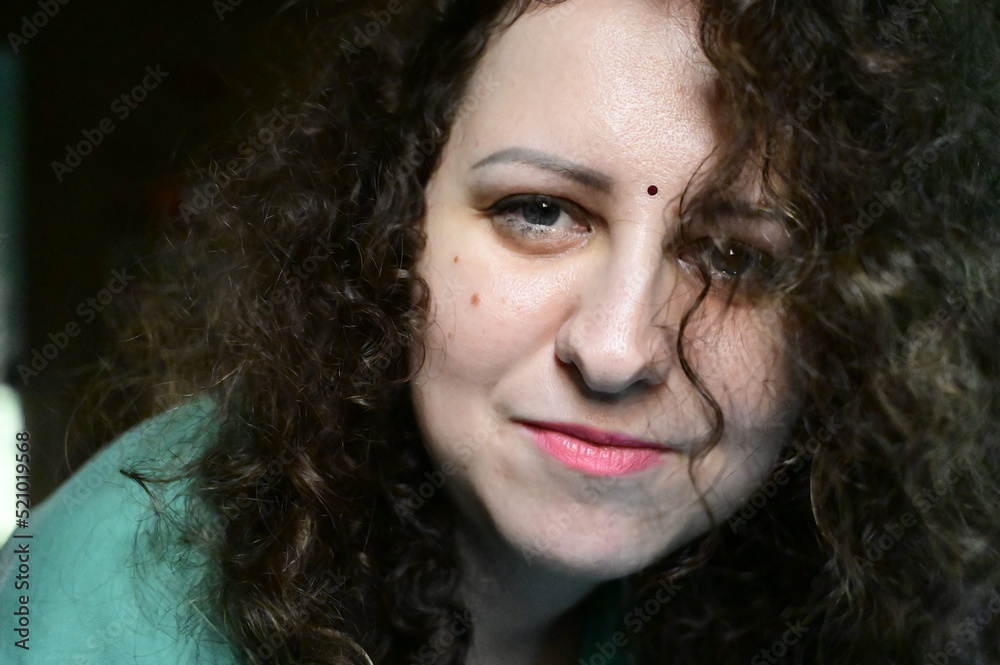 portrait of a person. Curly Hairs. Beautiful Face with Pink Lips. portrait of a person. Curly Hairs. Beautiful Face with Pink Lips.