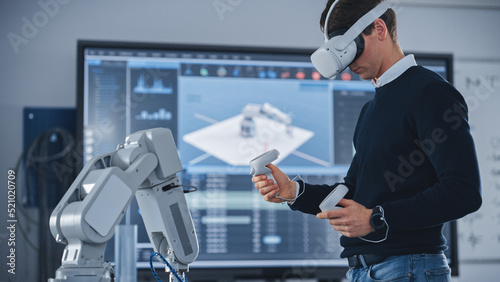 Mechanical Engineer Student Wearing Virtual Reality Headset and Holding Controllers, Uses VR technology for Industrial Design, Development, Prototyping in Robotics. High Tech Concept