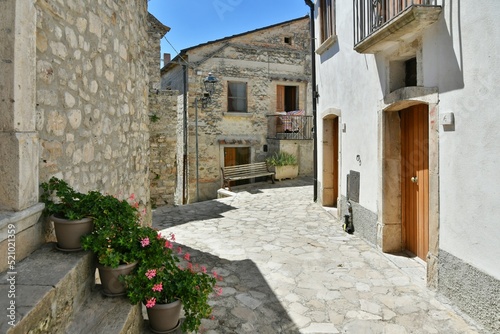 Fototapeta Naklejka Na Ścianę i Meble -  A small street between the old houses of Zungoli, one of the most beautiful villages in Italy.