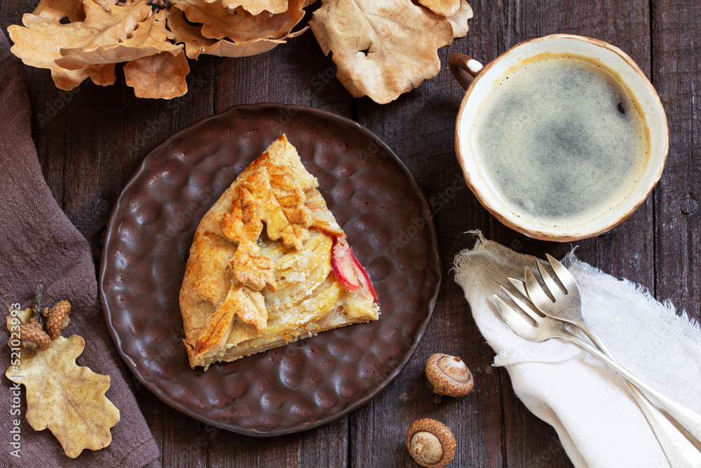 Whole wheat gallet with apple and pear, served with coffee. Rustic style.
