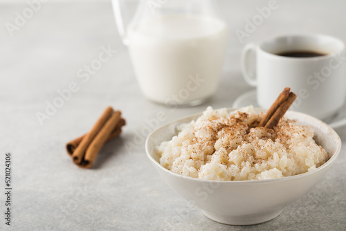  Scandinavian rice porridge in a bowl with cinnamon. Healthy breakfast. photo