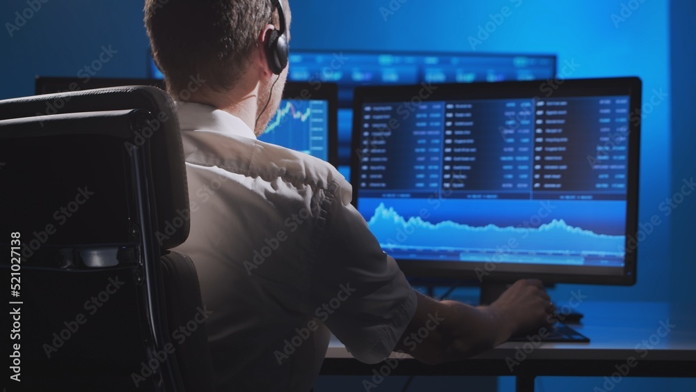 Fototapeta premium Broker works in office using workstation and analysis technology. Workplace of professional trader. Global financial markets, business strategy, currency exchange and banking.