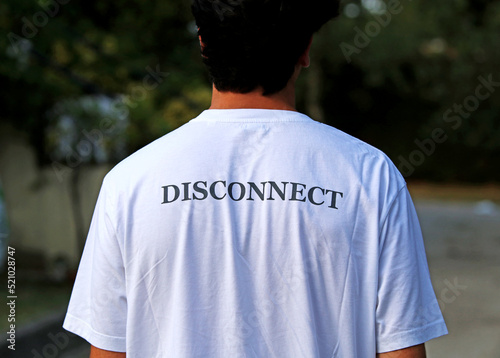 Young guy with a t-shirt with a message for vacation