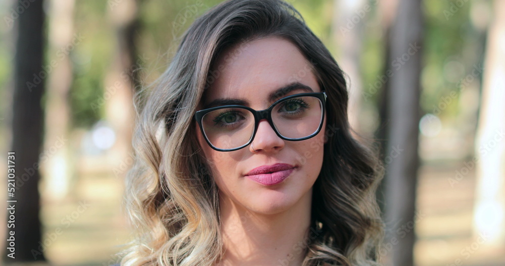 Pretty woman wearing glasses looking to camera Pretty woman wearing glasses looking to camera