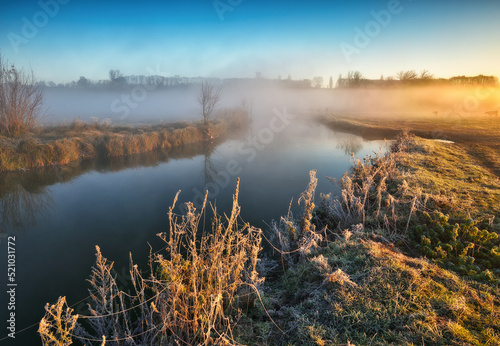 Fog over the river in the early morning on an autumn day. Nature of Ukraine