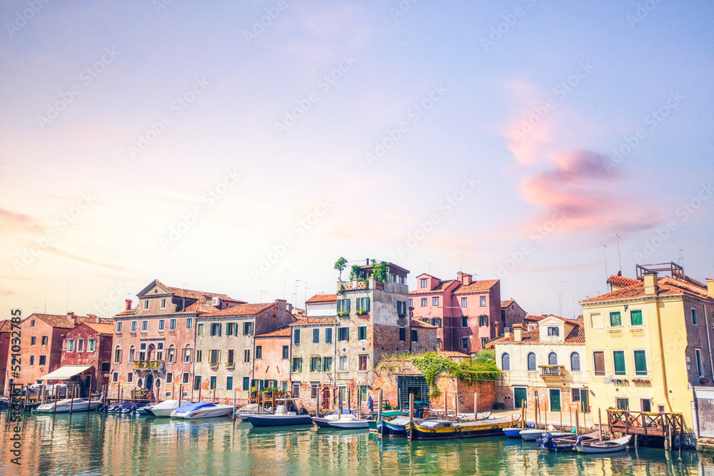 Boats outside old residents in Venice Italy
