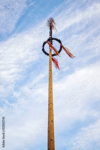 Tall maypole in the summer
