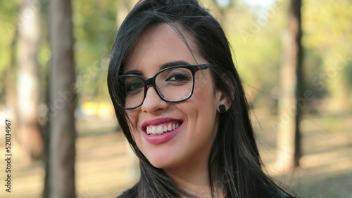 Hispanic woman wearing glasses looking to camera Smart Latina girl