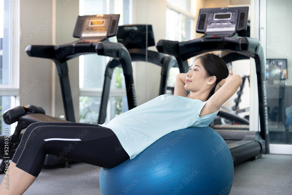 Beautiful and shapely Asian woman working out in the gym, Play exercise machine treadmill, Dumbbell, stretching, Hanging bar, Barbell, Cardio, Stretch, Woman warming up in the gym, Jump rope. Beautiful and shapely Asian woman working out in the gym, Play exercise machine treadmill, Dumbbell, stretching, Hanging bar, Barbell, Cardio, Stretch, Woman warming up in the gym, Jump rope.