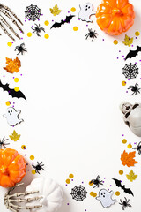Happy Halloween holiday concept. Halloween poster design. Frame made of Halloween decorations, pumpkins, bats, spiders, webs, ghosts on white background. Flat lay, top view, copy space.