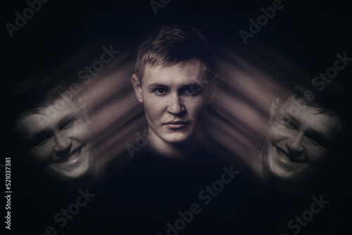 Bipolar young man with split personality and emotional disorder, hiding the real emotions, dissimulation concept. Inner emotional changes, mental health problem photo