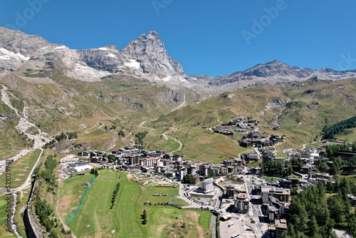Panoramic view from above the village of Breuil-Cervinia with the Matterhorn in the background. Breuil-Cervinia, Italy - August 2022